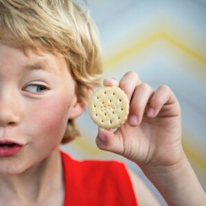 Boy holding cool biscuit